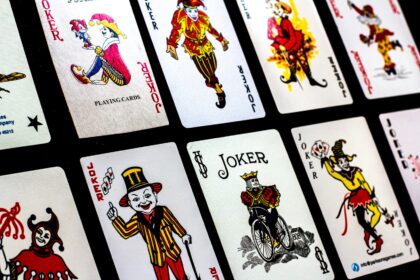 a group of playing cards with clowns on them