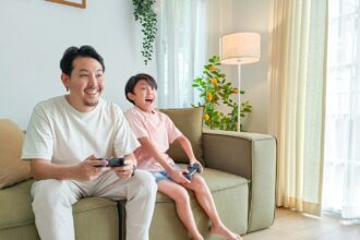a person and a child sitting on a couch